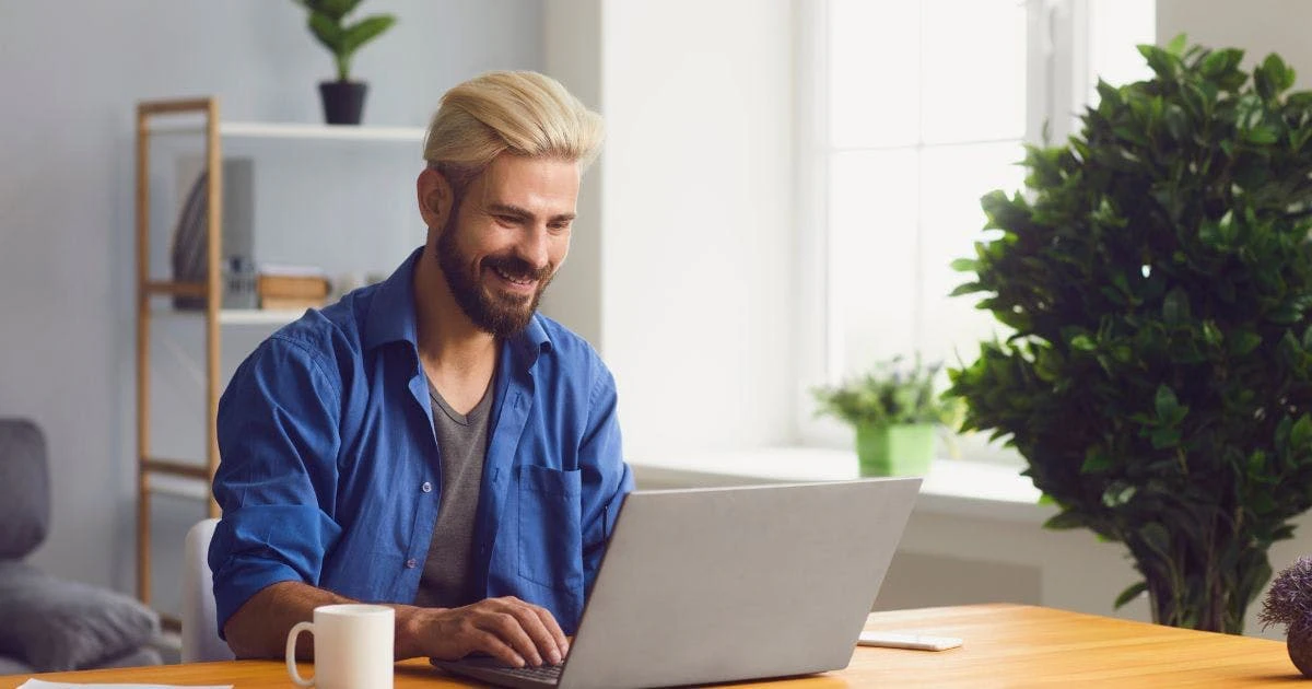 Freelancer working happily from home using Freel platform